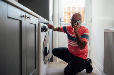 dryer sheet being placed into laundry machine